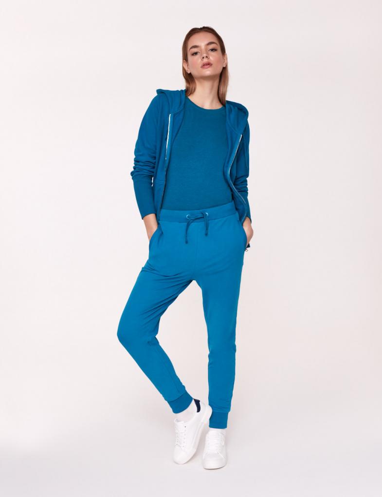 Жіночі спортивні штани з кишенями з декором Colors System бірюзові